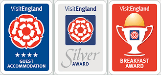 three of the awards awarded to kilbrannan guest house which are the visit england four star guest house award, the visit england breakfast award and the visit england silver award.